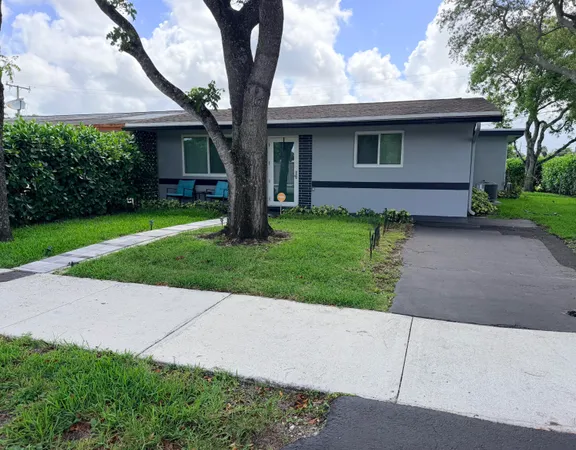 a front view of house with yard