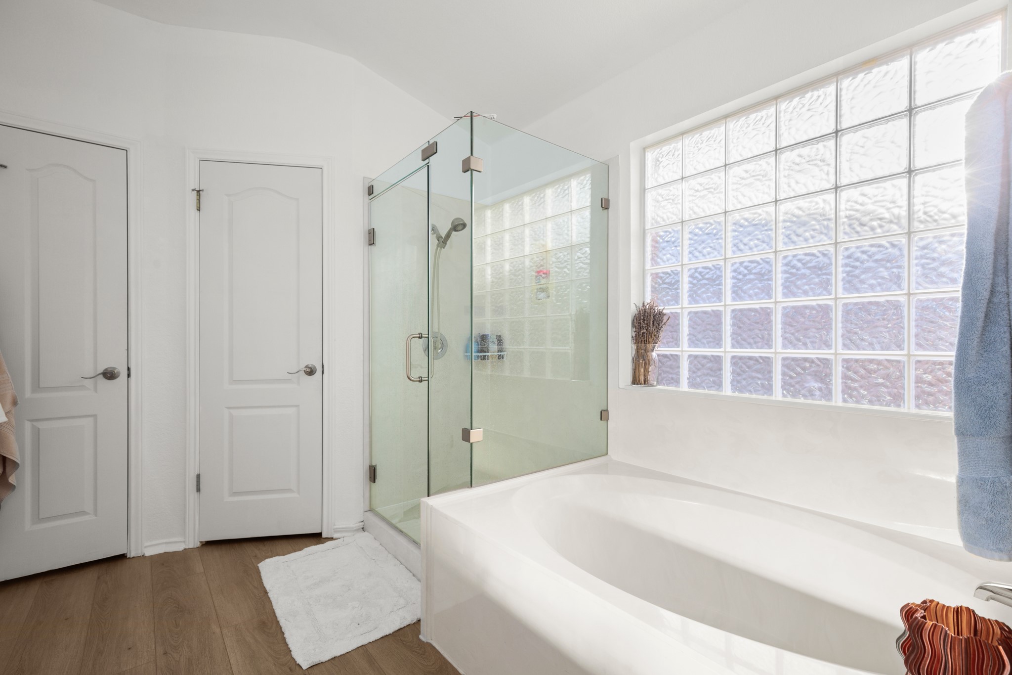 4523 Ramies Run Austin, TX 78749 - Photo 12 of 30 Bathroom with a shower stall, a bath, and dark wood-style flooring