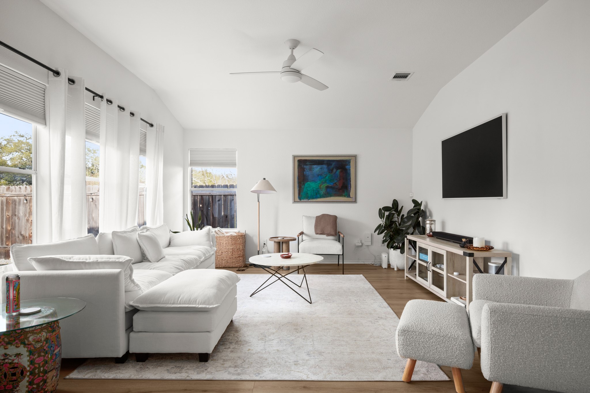 4523 Ramies Run Austin, TX 78749 - Photo 20 of 30 Living room featuring vaulted ceiling, wood finished floors, and a ceiling fan