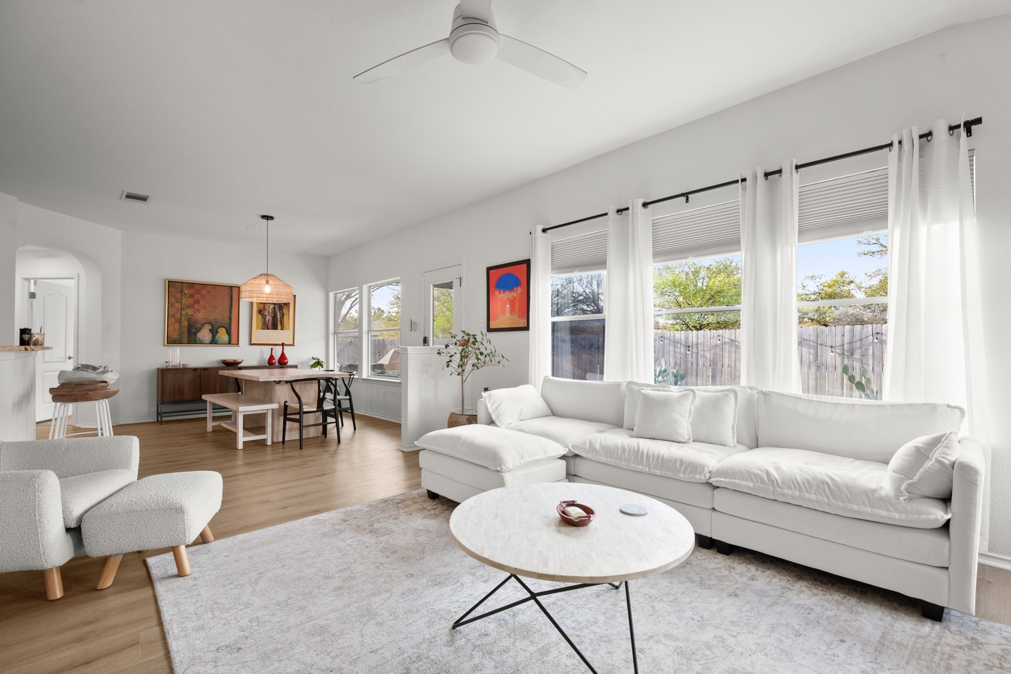 4523 Ramies Run Austin, TX 78749 - Photo 21 of 30 Living area with light wood finished floors and a ceiling fan