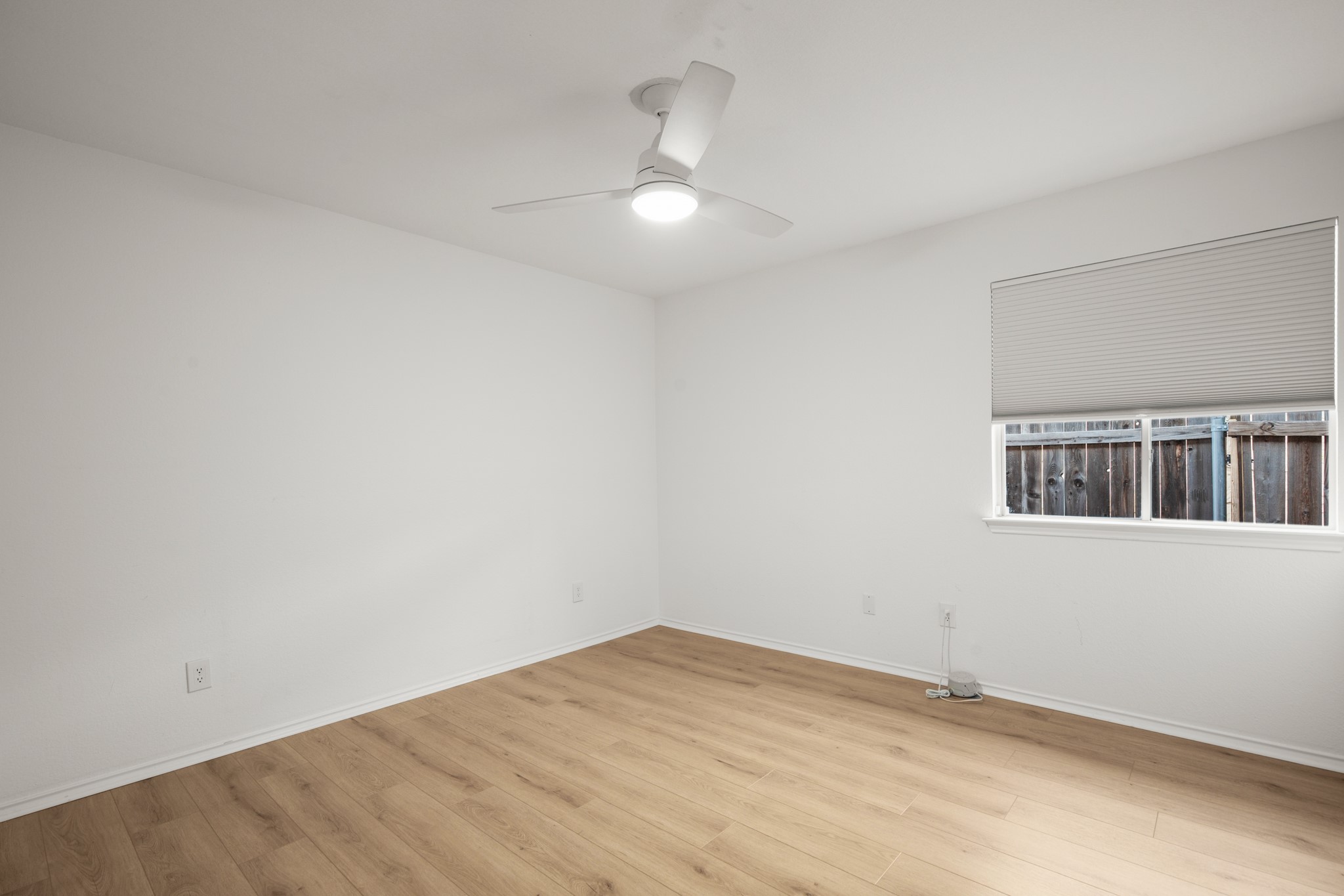 4523 Ramies Run Austin, TX 78749 - Photo 6 of 30 Unfurnished room with light wood-type flooring and ceiling fan