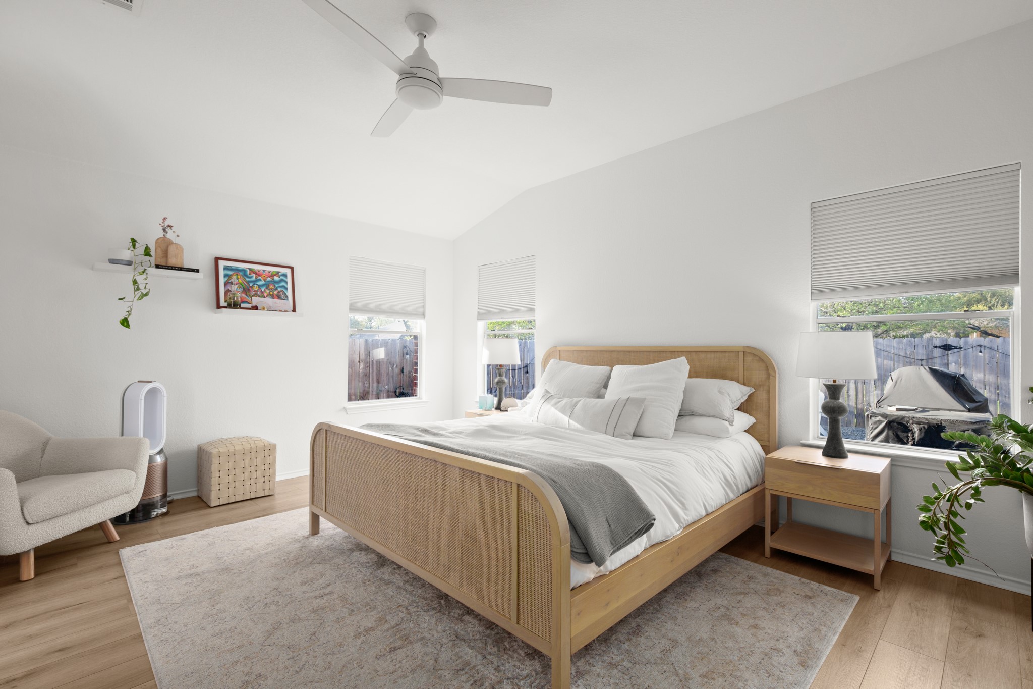 4523 Ramies Run Austin, TX 78749 - Photo 9 of 30 Bedroom featuring lofted ceiling, a ceiling fan, and light wood-type flooring