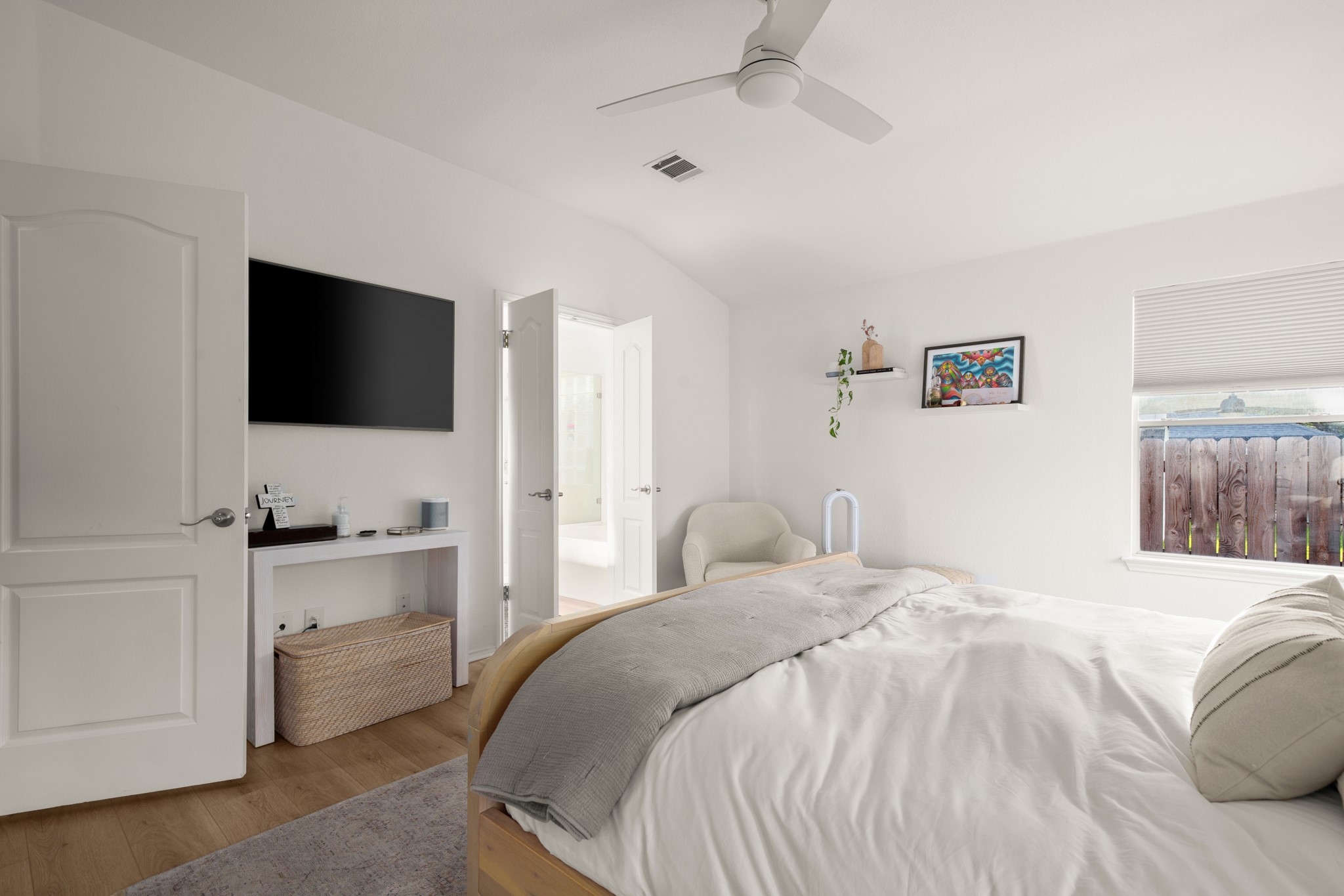 4523 Ramies Run Austin, TX 78749 - Photo 10 of 30 Bedroom with lofted ceiling, wood finished floors, and a ceiling fan