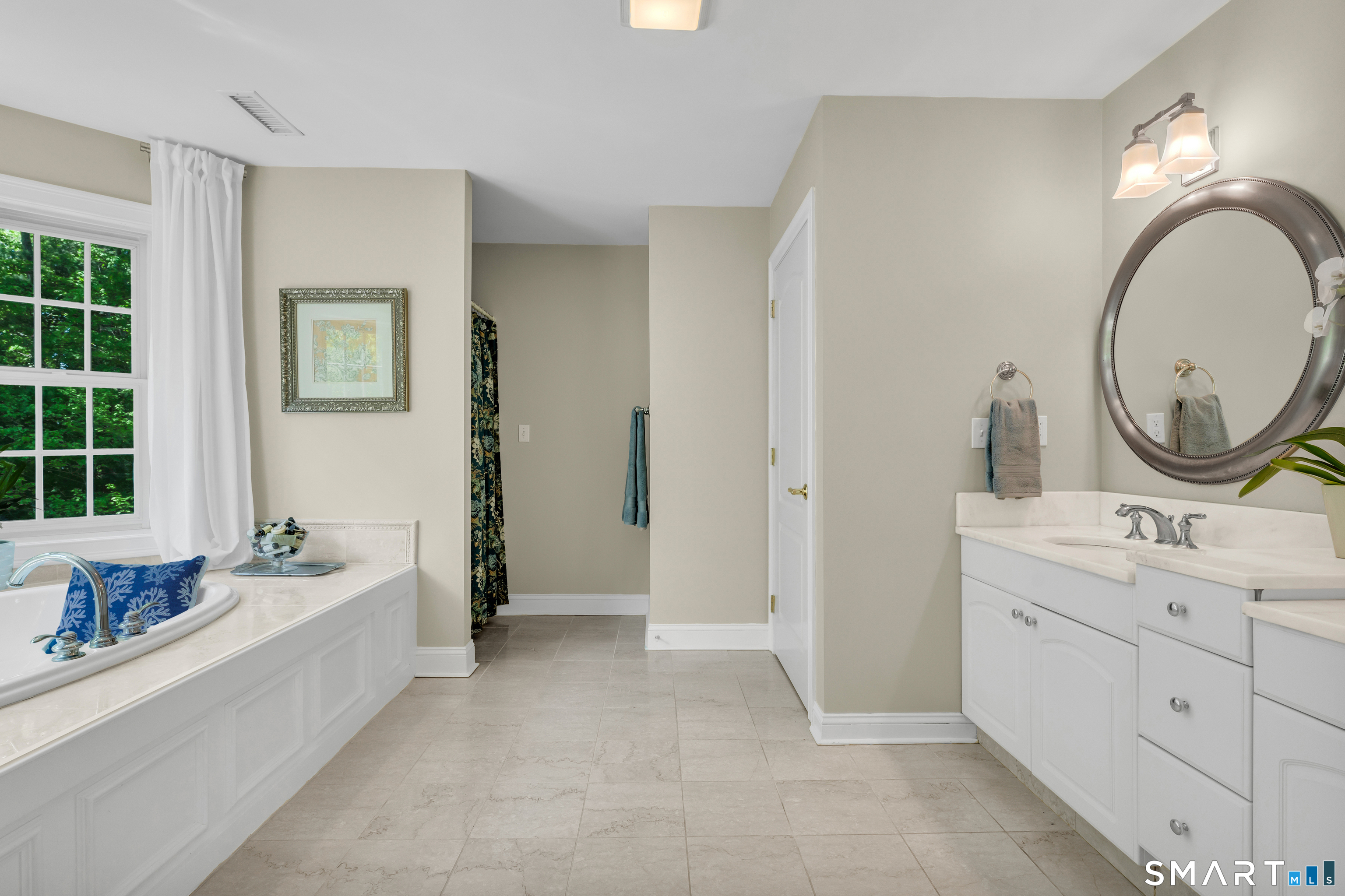474 State Street Guilford, CT 06437 - Photo 23 of 40 a spacious bathroom with a sink double vanity and a mirror