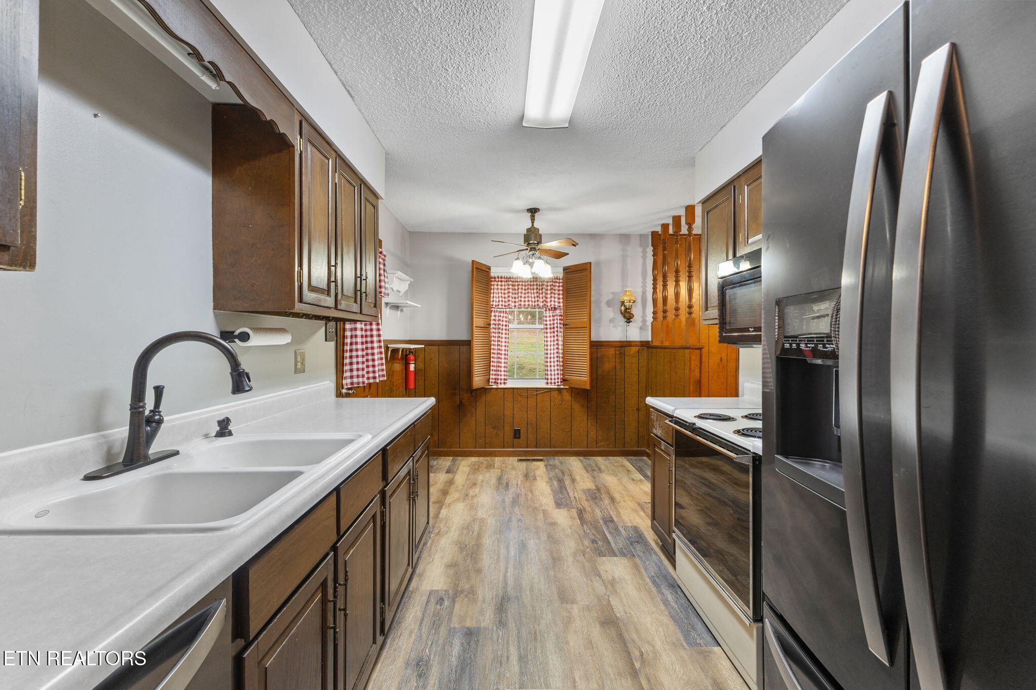 7536 Rodgers Road Corryton, TN 37721 - Photo 10 of 41 a kitchen with stainless steel appliances a sink stove and refrigerator