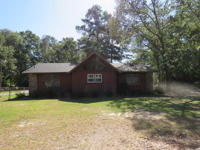 3774 Holley Road Lizella, GA 31052 - Photo 2 of 13 a front view of a house with a yard and garage