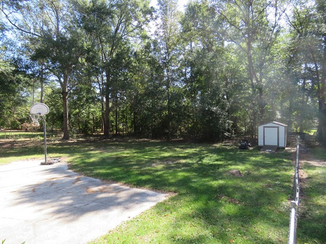 3774 Holley Road Lizella, GA 31052 - Photo 4 of 13 a view of a park with large trees