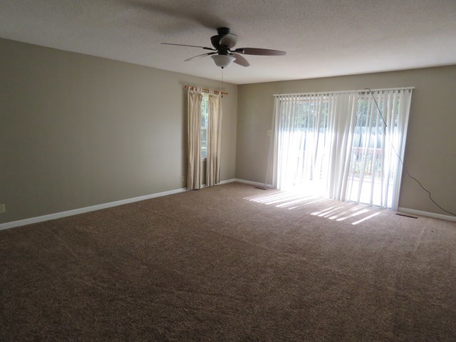 3774 Holley Road Lizella, GA 31052 - Photo 6 of 13 a view of a livingroom with an empty space and a window