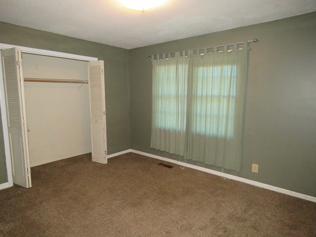 3774 Holley Road Lizella, GA 31052 - Photo 10 of 13 an empty room with sliding door