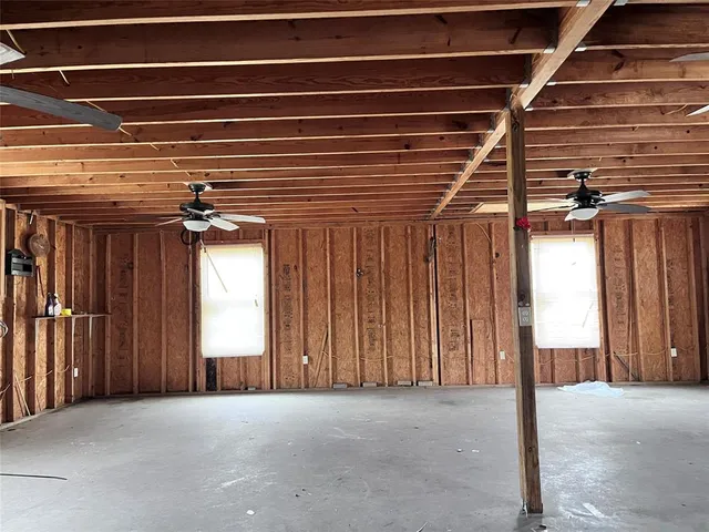 a view of a room with wooden walls