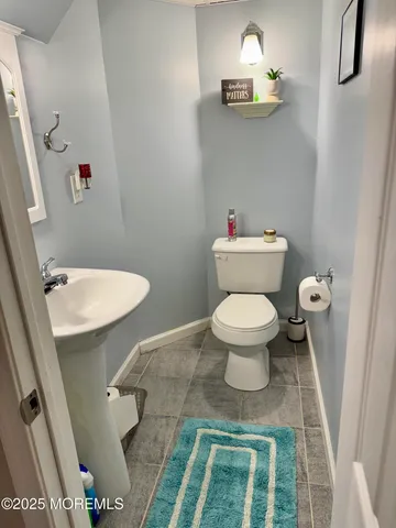 a bathroom with a toilet and a sink