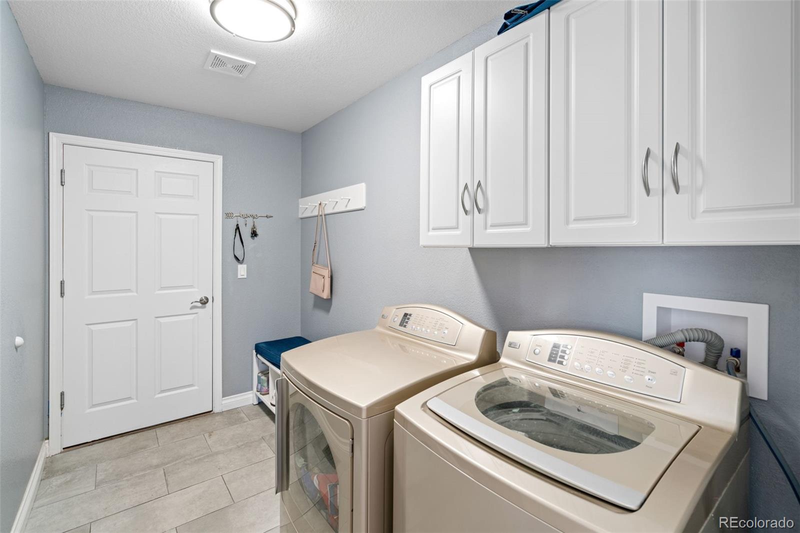 2667 West Bitterroot Place Highlands Ranch, CO 80129 - Photo 18 of 40 a utility room with dryer and washer