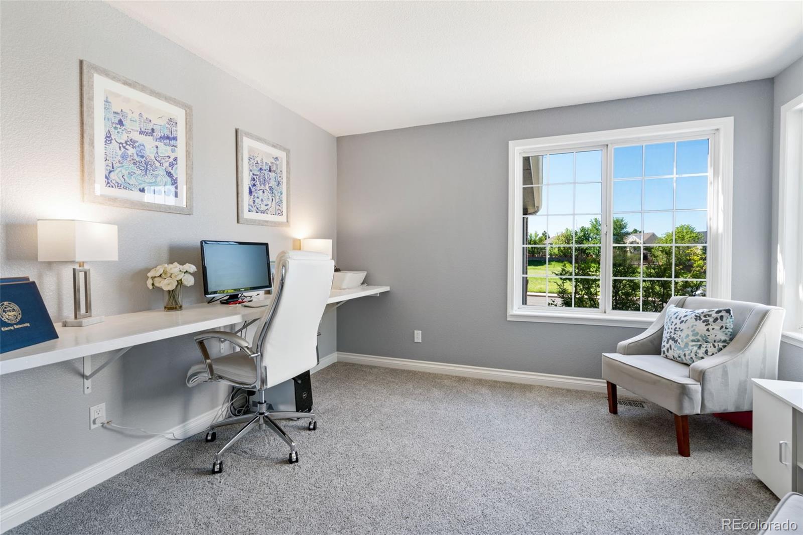 2667 West Bitterroot Place Highlands Ranch, CO 80129 - Photo 19 of 40 a workspace with lounge chair and a window