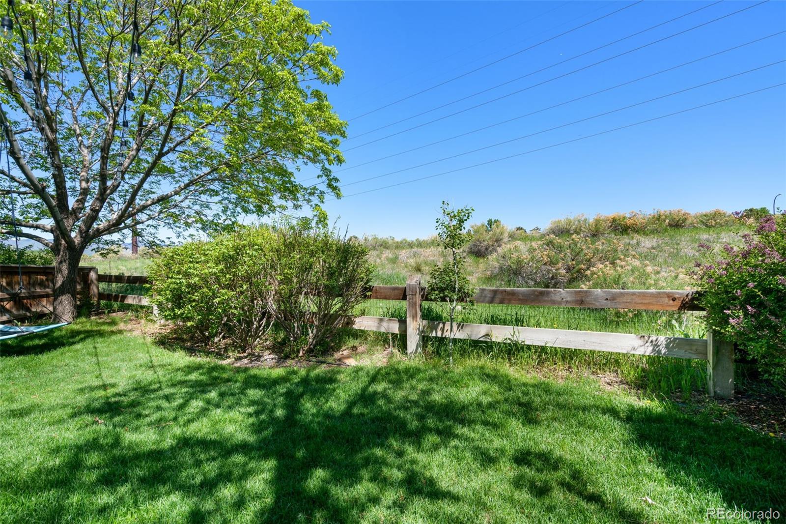 2667 West Bitterroot Place Highlands Ranch, CO 80129 - Photo 38 of 40 a view of lake with a big yard