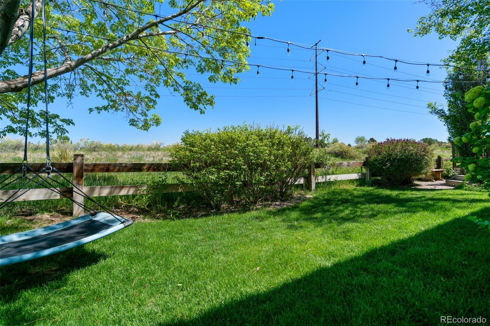2667 West Bitterroot Place Highlands Ranch, CO 80129 - Photo 39 of 40 a view of a garden with a tree
