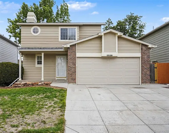 a front view of a house with garage