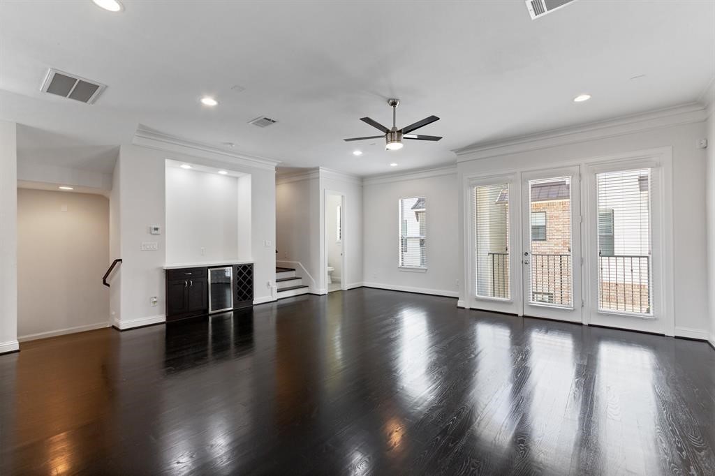 1525 Johnson Street Houston, TX 77007 - Photo 13 of 26 a view of an empty room with wooden floor and a window