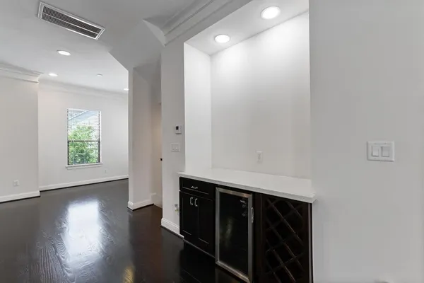 a room with wooden floor and window