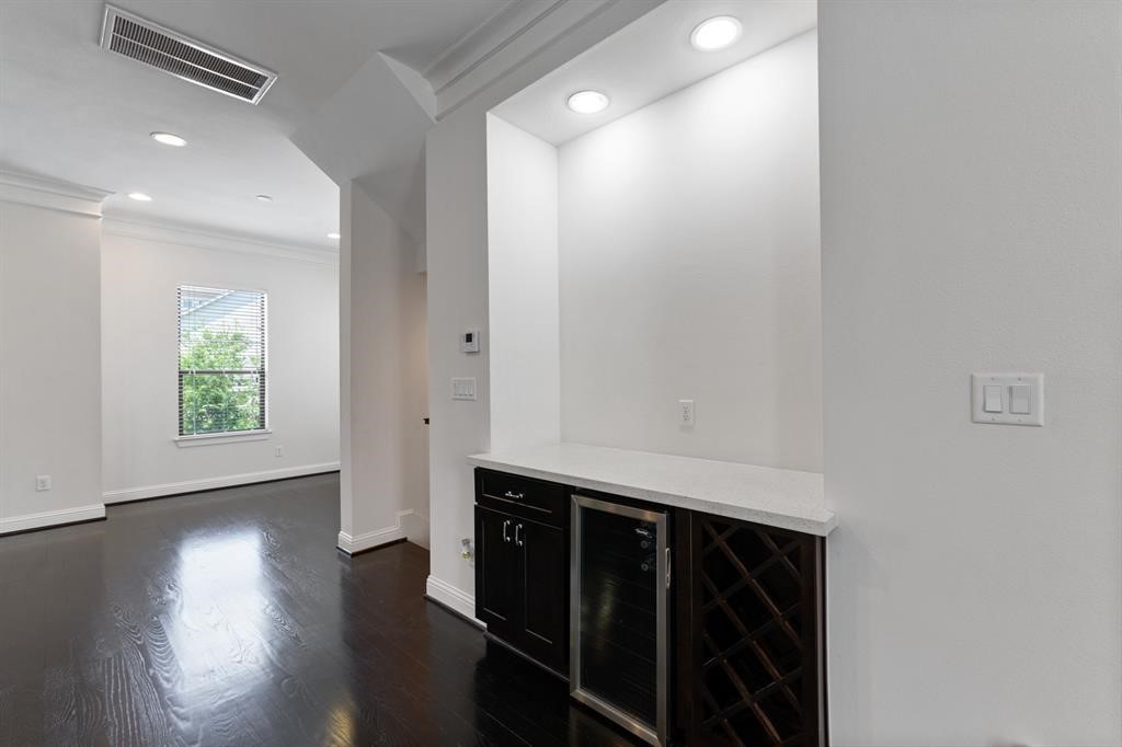 1525 Johnson Street Houston, TX 77007 - Photo 14 of 26 a room with wooden floor and window