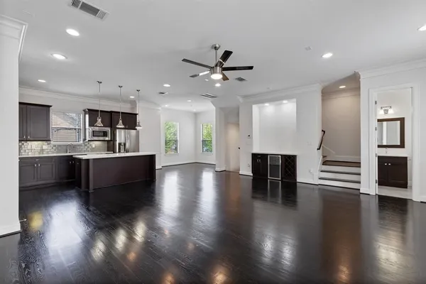 a view of kitchen with cabinets and wooden floor