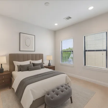 a bedroom with bed and window