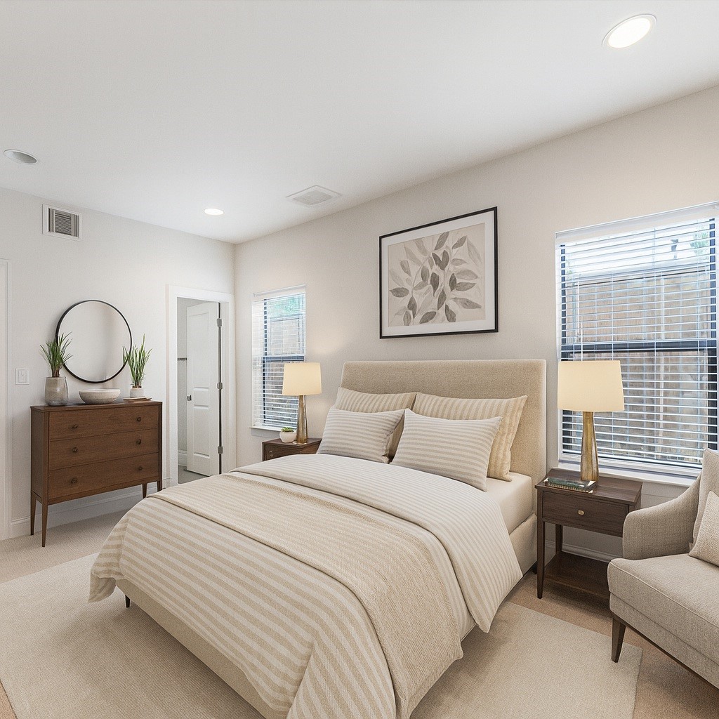 1525 Johnson Street Houston, TX 77007 - Photo 4 of 26 a bedroom with bed and a couch