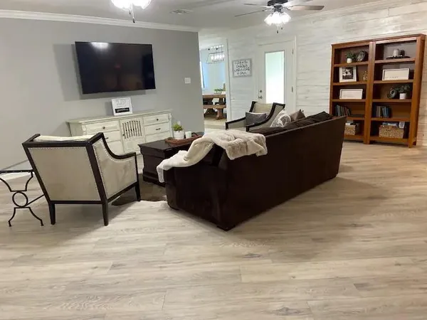 a living room with furniture and a flat screen tv