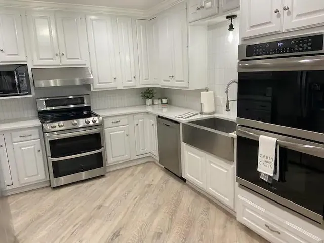a kitchen with a stove and a microwave