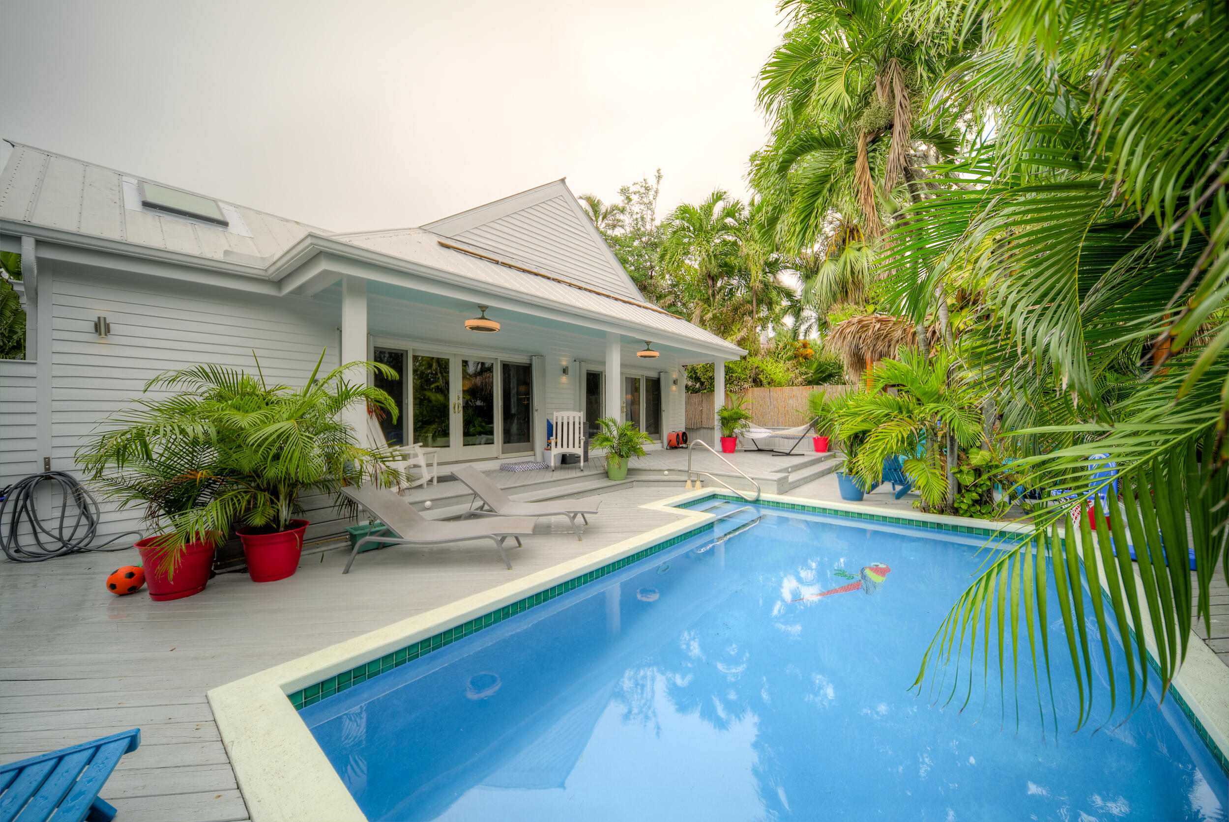 720 Washington Street Key West, FL 33040 - Photo 17 of 33 a view of house with swimming pool and sitting area