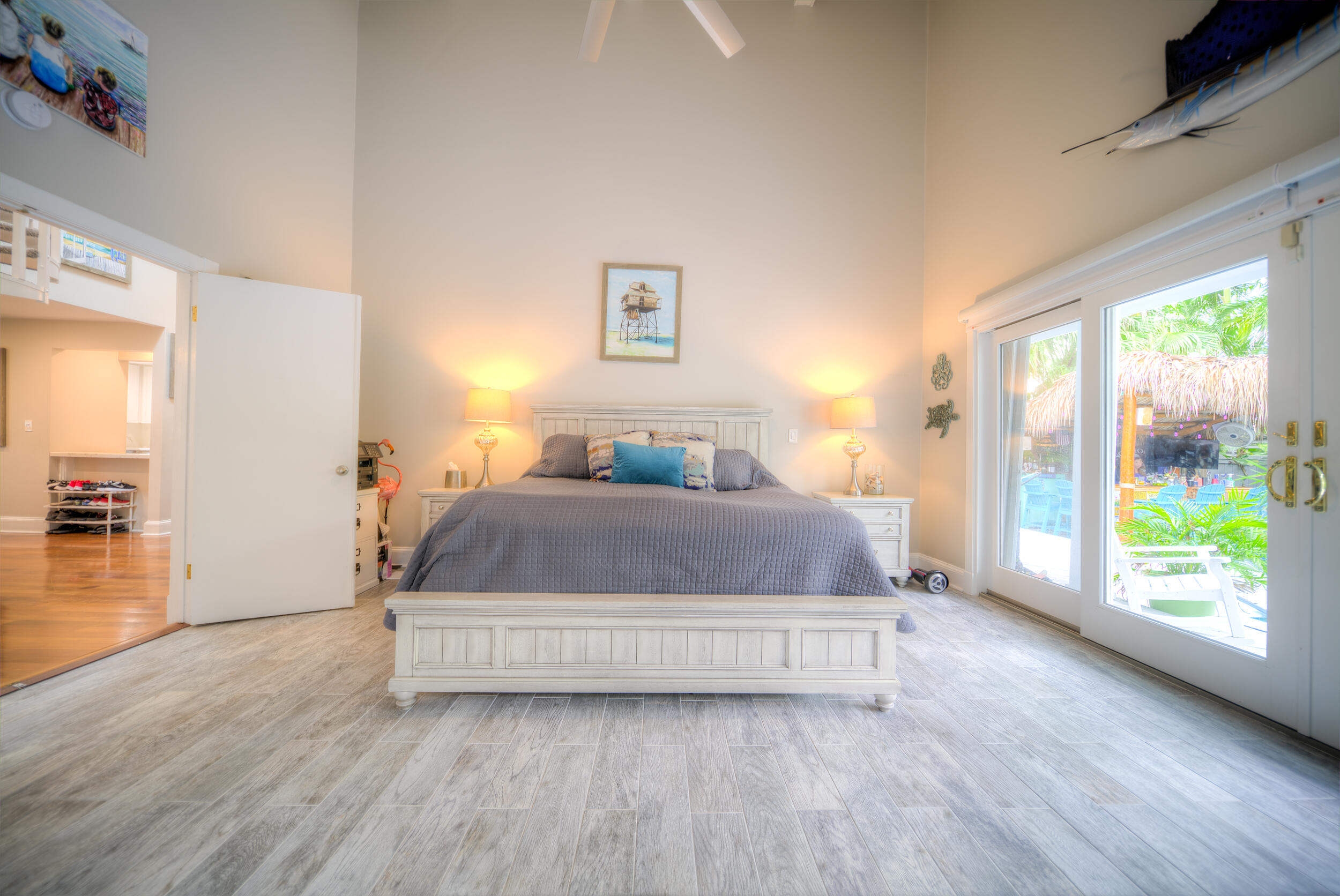 720 Washington Street Key West, FL 33040 - Photo 18 of 33 a spacious bedroom with a bed and a large window