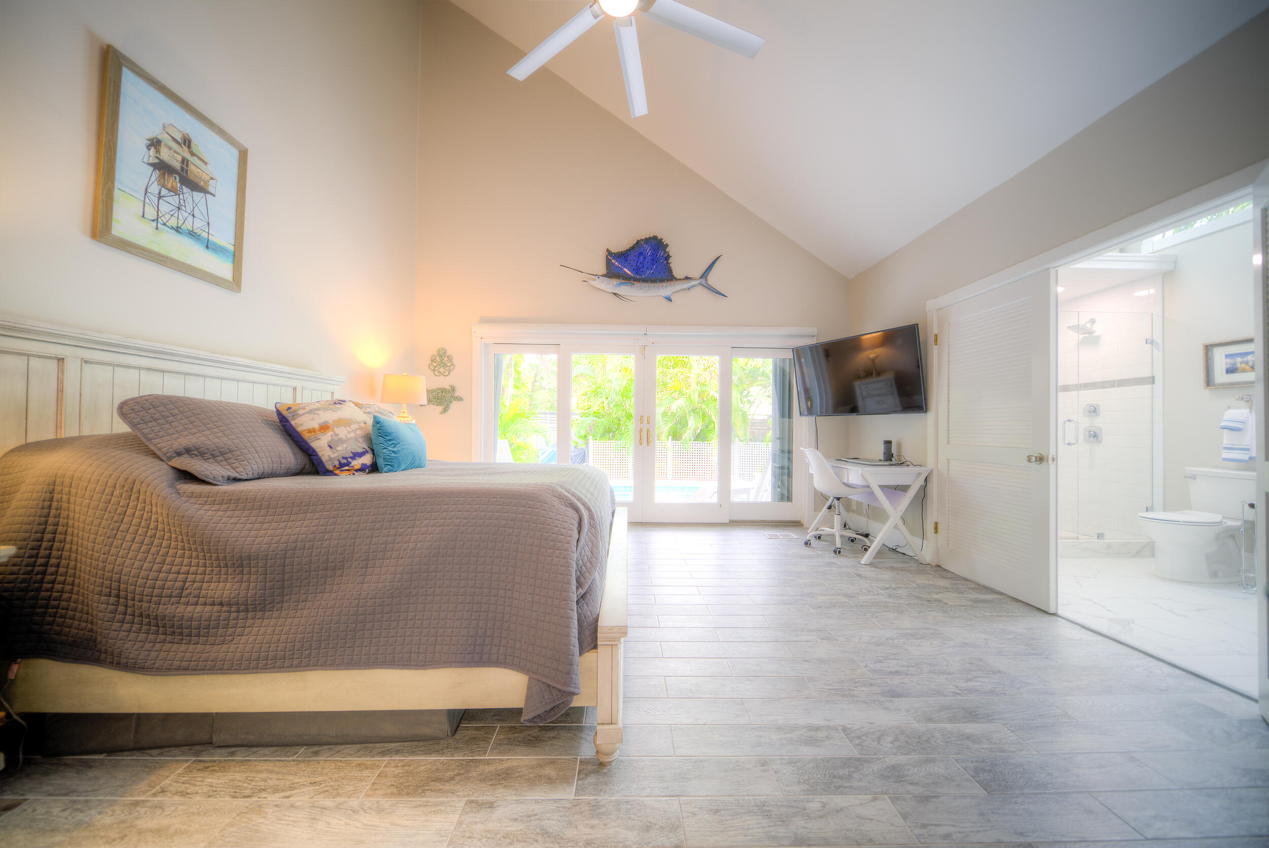 720 Washington Street Key West, FL 33040 - Photo 19 of 33 a bedroom with a bed and a large window