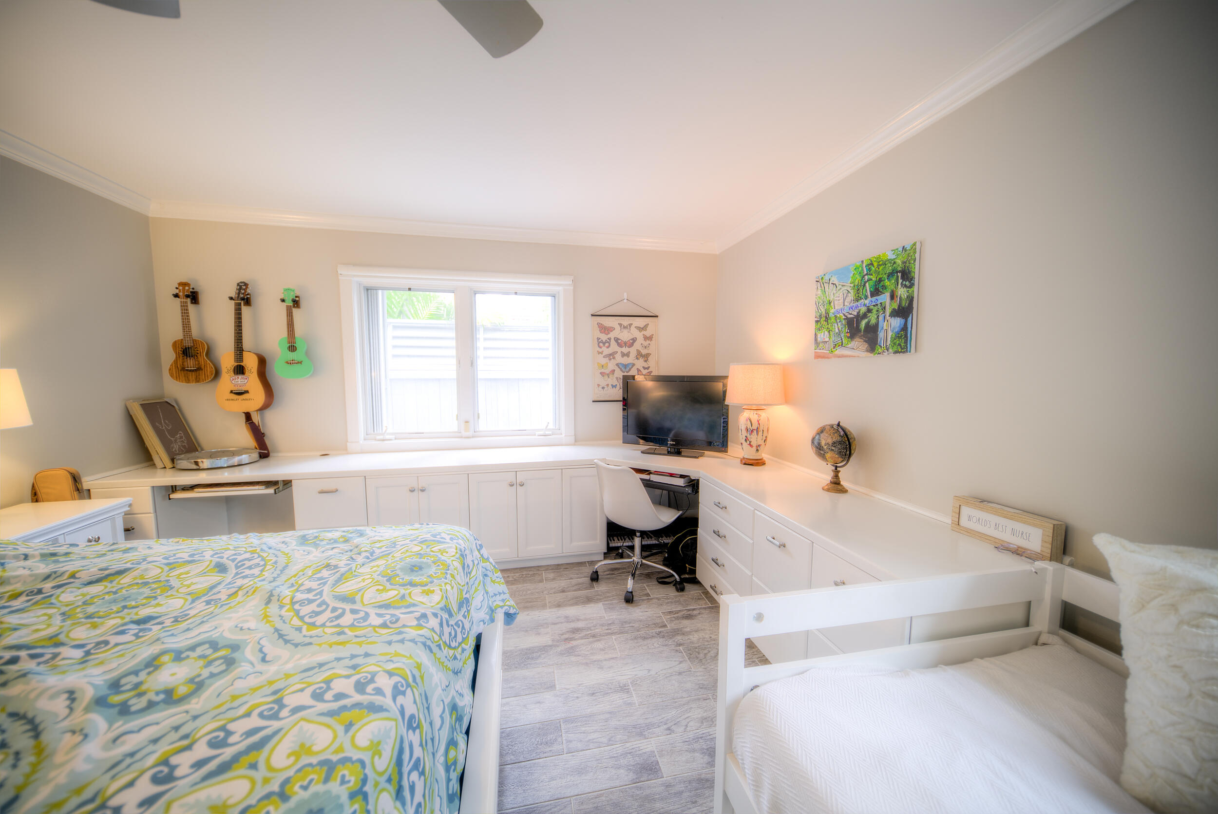 720 Washington Street Key West, FL 33040 - Photo 22 of 33 a bedroom with a bed and a desk