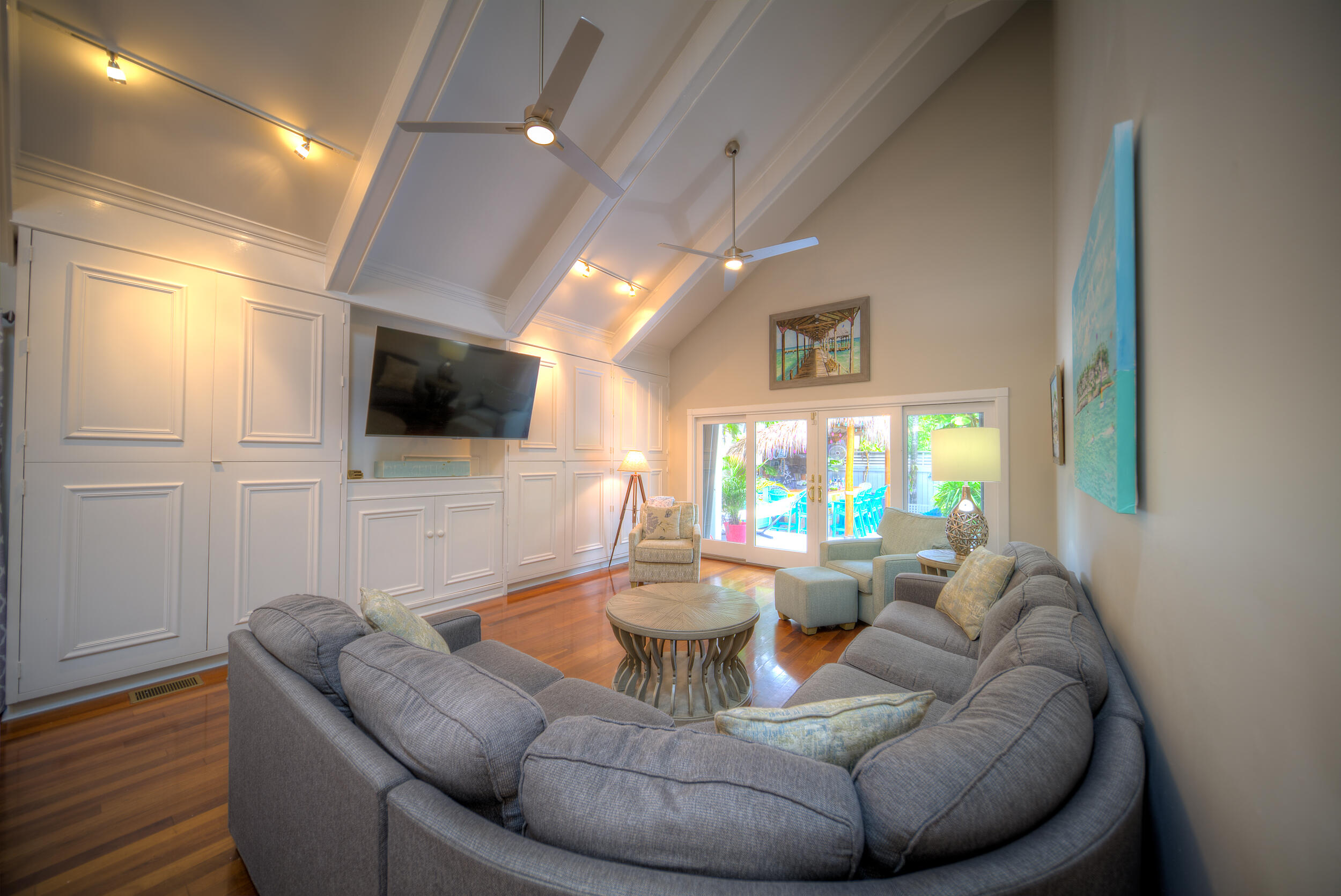 720 Washington Street Key West, FL 33040 - Photo 4 of 33 a living room with furniture and a flat screen tv