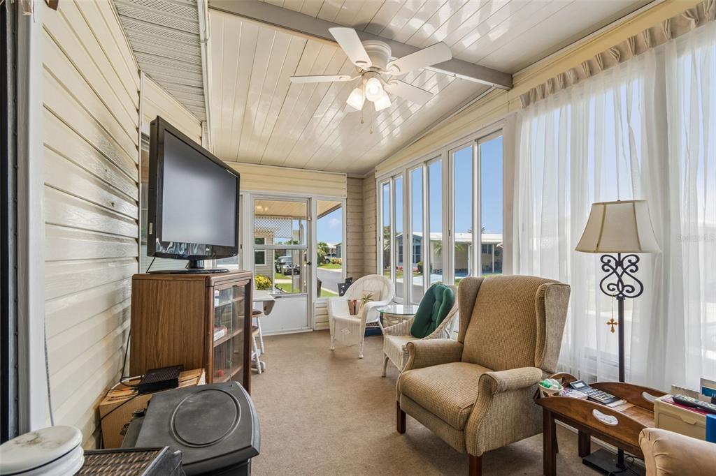 12501 Ulmerton Road, Unit 175 Largo, FL 33774 - Photo 3 of 32 a living room with furniture and a large window