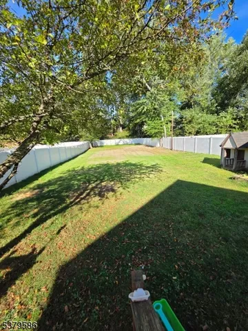 a view of a yard with an outdoor space