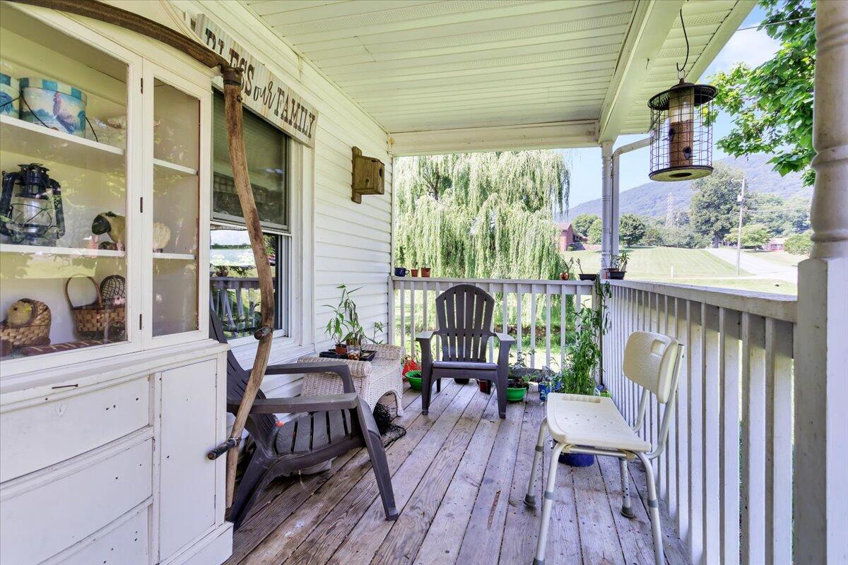 4090 Rockingham Boulevard Roanoke, VA 24014 - Photo 4 of 32 a view of a house with a porch and furniture