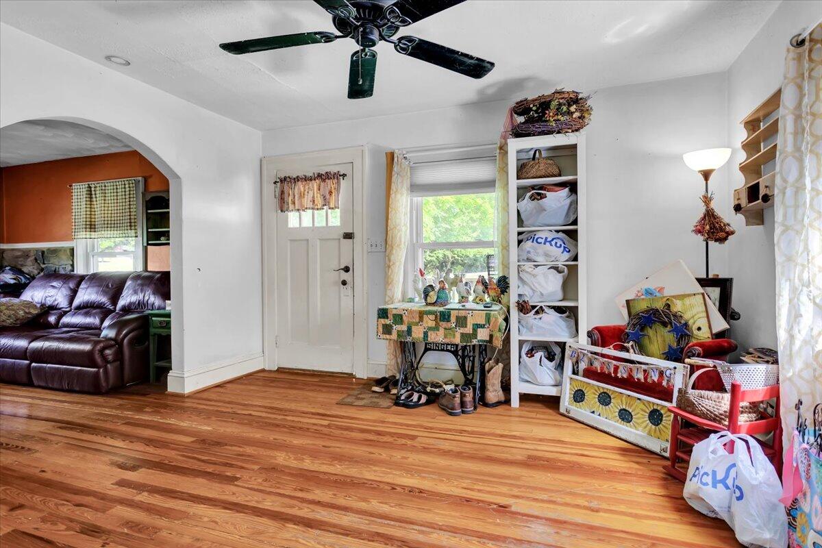 4090 Rockingham Boulevard Roanoke, VA 24014 - Photo 5 of 32 a bedroom with furniture and a wooden floor