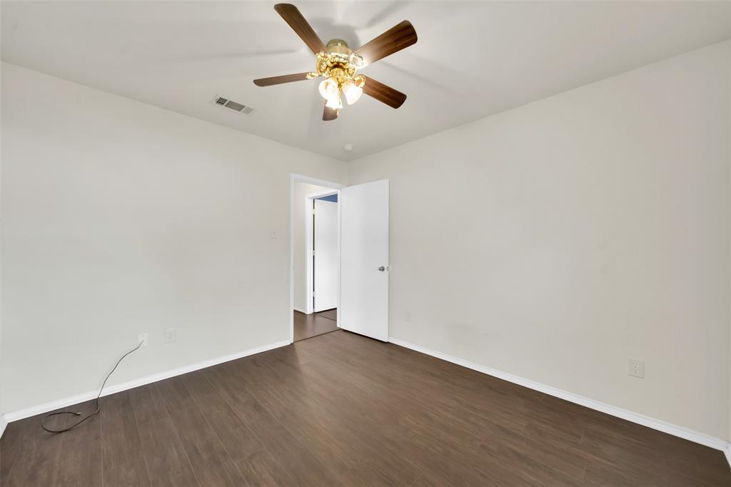 4221 Fiste Denton, TX 76207 - Photo 20 of 26 Empty room with ceiling fan and dark hardwood / wood-style floors