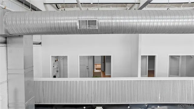 a view of staircase with wooden floor and stairs