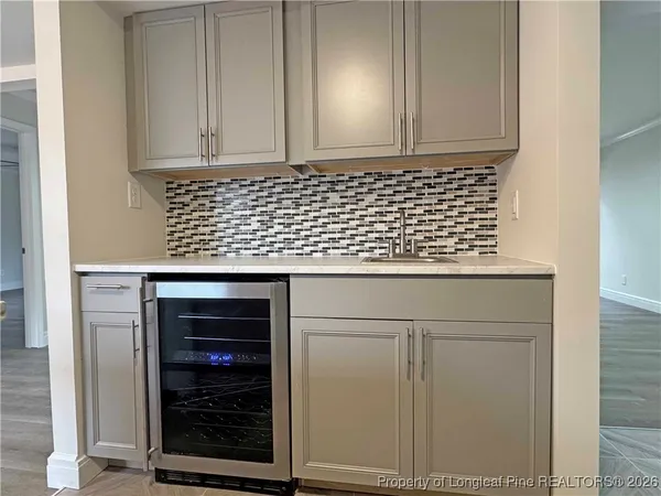 a bathroom with a sink and cabinets