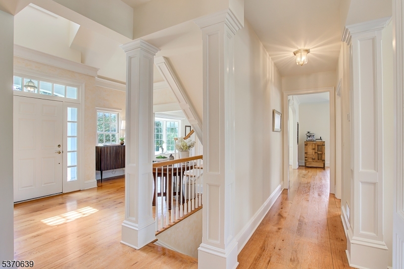 579 Goritz Road Asbury, NJ 08802 - Photo 16 of 50 a view of a hallway with wooden floor and windows