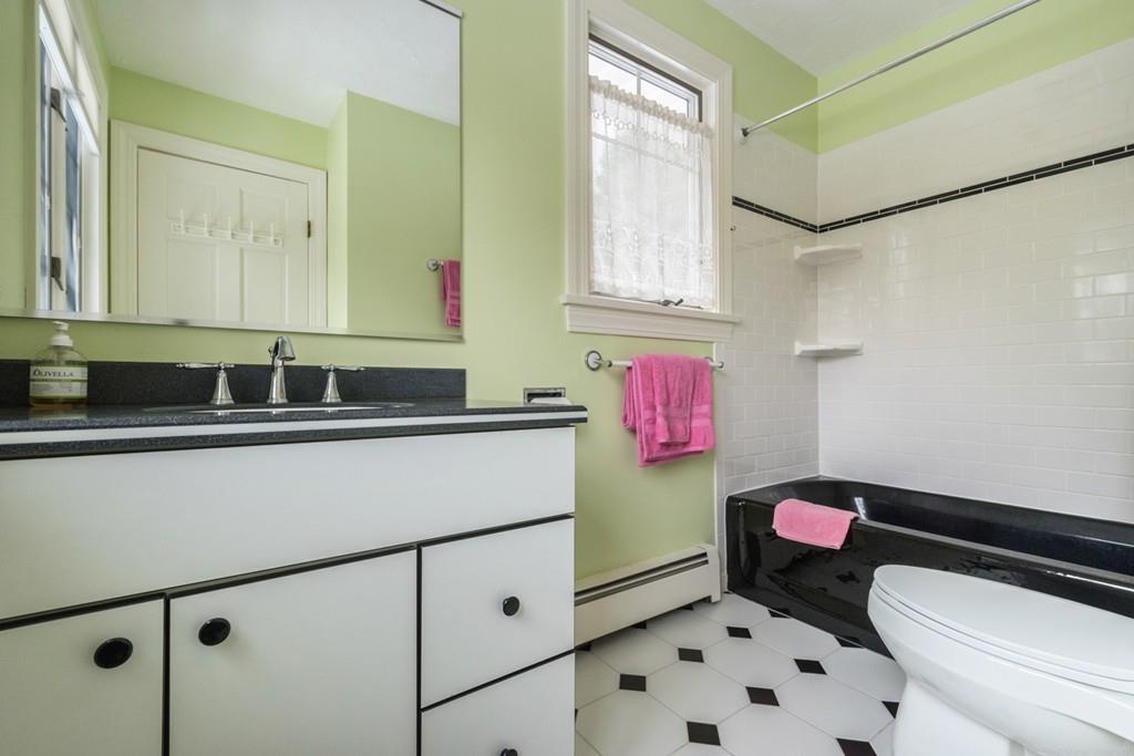 354 Burroughs Road Boxborough, MA 01719 - Photo 30 of 40 a bathroom with a sink a toilet and shower curtain