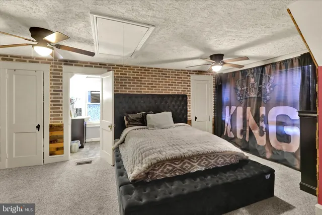 a bedroom with a bed and a mirror