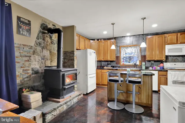 a kitchen with a sink appliances and cabinets