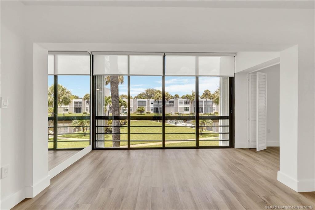 1950 Southwest Palm City Road, Unit 3201 Stuart, FL 34994 - Photo 17 of 51 an empty room with large windows