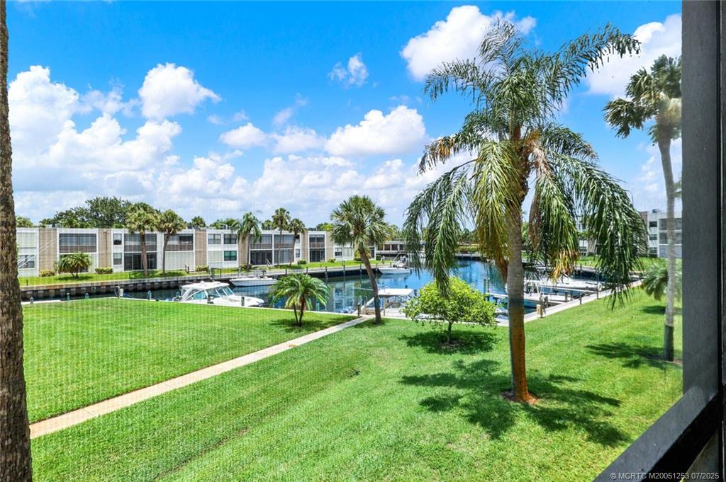 1950 Southwest Palm City Road, Unit 3201 Stuart, FL 34994 - Photo 19 of 51 a view of a big yard with plants and large trees