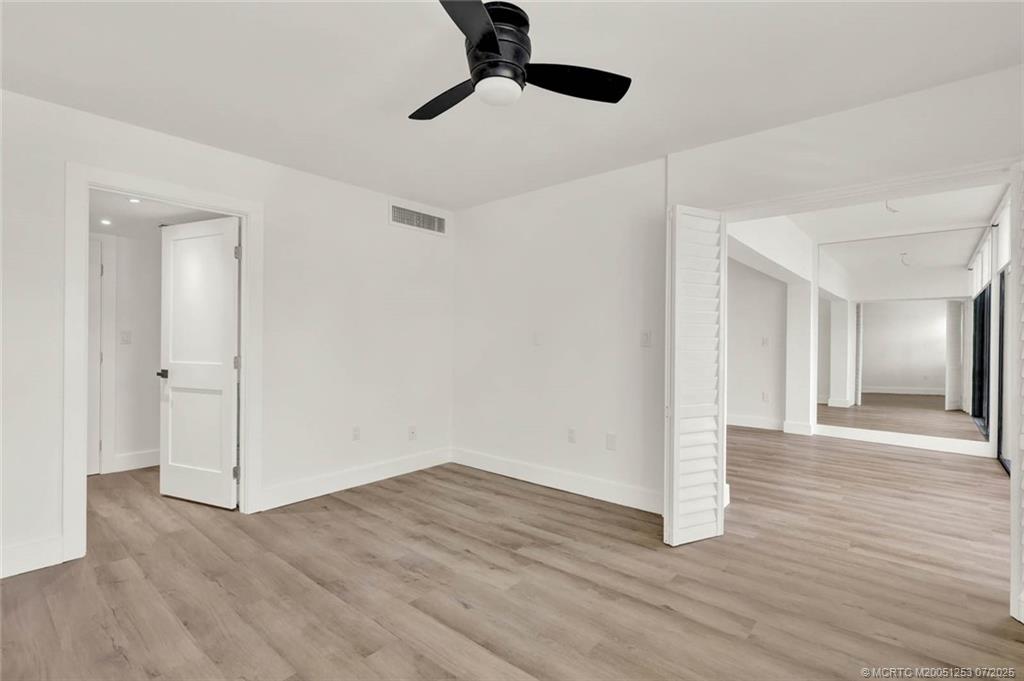 1950 Southwest Palm City Road, Unit 3201 Stuart, FL 34994 - Photo 24 of 51 a view of an empty room with wooden floor