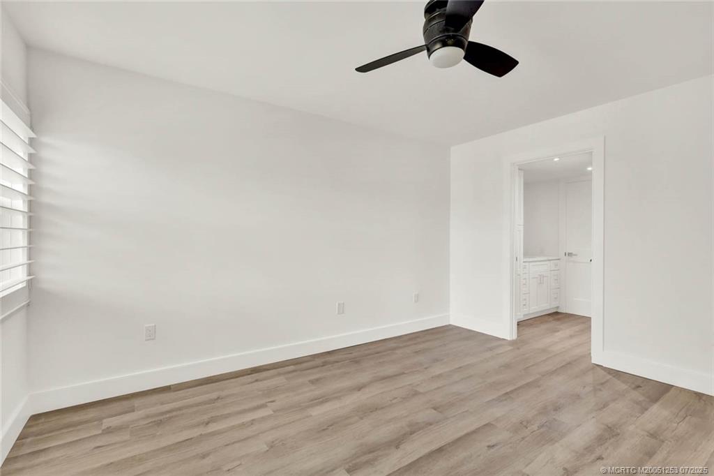 1950 Southwest Palm City Road, Unit 3201 Stuart, FL 34994 - Photo 26 of 51 wooden floor in an empty room