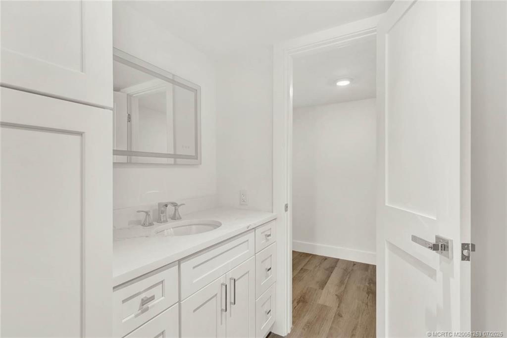 1950 Southwest Palm City Road, Unit 3201 Stuart, FL 34994 - Photo 27 of 51 a bathroom with a sink a vanity and a mirror