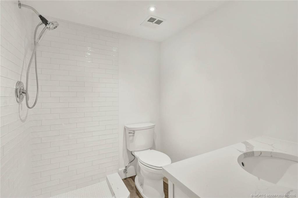 1950 Southwest Palm City Road, Unit 3201 Stuart, FL 34994 - Photo 34 of 51 a white toilet sitting next to a bath tub